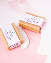 Load image into Gallery viewer, london ivy oat milk + Lavender soap / cleansing bars with oat milk being poured